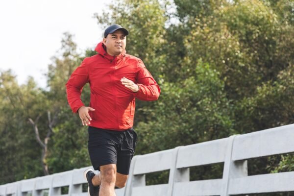 Man running across a bridge